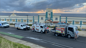 Three Plumbing Life Saver service trucks parked side by side